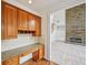 The kitchen features a built-in desk area with granite countertops, wooden cabinets and an open floor plan at 5066 Healey Dr, Smyrna, GA 30082