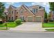 Traditional brick two-story home with a well-maintained lawn and two-car garage at 5066 Healey Dr, Smyrna, GA 30082