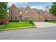 Beautiful brick two-story home with well-manicured lawn and a two-car attached garage at 5066 Healey Dr, Smyrna, GA 30082