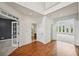 Bright foyer featuring gleaming hardwood floors, a soaring ceiling, and elegant architectural details at 5066 Healey Dr, Smyrna, GA 30082