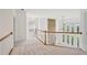 Upstairs hallway showcasing the railing and open floorplan at 5066 Healey Dr, Smyrna, GA 30082
