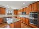 This kitchen features granite countertops, a center island, stainless steel appliances and wooden cabinets at 5066 Healey Dr, Smyrna, GA 30082