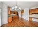 A spacious kitchen features wooden cabinets, granite countertops, a center island and stainless steel appliances at 5066 Healey Dr, Smyrna, GA 30082