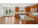 A bright kitchen features a granite countertop, stainless steel appliances, and leads to an open floor plan at 5066 Healey Dr, Smyrna, GA 30082