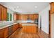 A well-equipped kitchen features stainless steel appliances, granite countertops, wooden cabinets and a center island at 5066 Healey Dr, Smyrna, GA 30082