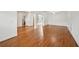 Bright living room with hardwood floors and white walls, featuring an open floor plan and natural light at 5066 Healey Dr, Smyrna, GA 30082