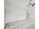 Spacious main bedroom with neutral carpet and ample natural light at 5066 Healey Dr, Smyrna, GA 30082