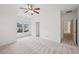 Bright main bedroom with plush carpeting, ceiling fan and ensuite bathroom access at 5066 Healey Dr, Smyrna, GA 30082