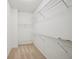 Walk-in closet featuring wire shelving and neutral carpet at 5066 Healey Dr, Smyrna, GA 30082