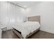Bright bedroom featuring hardwood floors, neutral walls and natural light from window at 6640 Avis Walk, Alpharetta, GA 30005