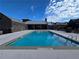 Clear blue community pool surrounded by modern architecture and ample deck space, perfect for relaxation and recreation at 6640 Avis Walk, Alpharetta, GA 30005