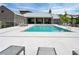 Community pool area surrounded by lounge chairs, a well-maintained deck, and fencing for relaxation and recreation at 6640 Avis Walk, Alpharetta, GA 30005