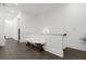Bright hallway featuring hardwood floors and decorative white bench at 6640 Avis Walk, Alpharetta, GA 30005