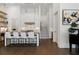Modern kitchen with island seating, custom cabinets, and hardwood floors for an inviting and elegant cooking space at 6640 Avis Walk, Alpharetta, GA 30005