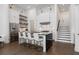 Well-lit kitchen with an island, stainless steel appliances, and open shelving perfect for modern living at 6640 Avis Walk, Alpharetta, GA 30005