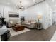 Open-concept living room with modern décor, hardwood floors, and recessed lights, with a modern chandelier at 6640 Avis Walk, Alpharetta, GA 30005