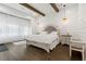 Bedroom with wood accent beams, modern farmhouse style, and lots of natural light at 6640 Avis Walk, Alpharetta, GA 30005