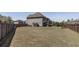 Large backyard with a wood fence, a storage shed, and a patio, perfect for outdoor activities at 7435 Ansley Park Way, Cumming, GA 30028