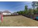 Spacious backyard with privacy fence and ample room for outdoor activities at 7435 Ansley Park Way, Cumming, GA 30028