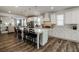 Bright, open kitchen with a large island, white cabinetry, and stainless steel appliances at 7435 Ansley Park Way, Cumming, GA 30028