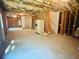 Spacious unfinished basement featuring stud framing, concrete floor, and room for customization and additional living space at 1652 Park Hollow Ln, Lawrenceville, GA 30043