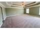 Large main bedroom features trey ceilings and neutral carpeting at 1652 Park Hollow Ln, Lawrenceville, GA 30043