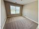 Neutral bedroom with a large window bringing in natural light at 1652 Park Hollow Ln, Lawrenceville, GA 30043