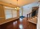 Bright dining room features hardwood floors, a chandelier, and natural light at 1652 Park Hollow Ln, Lawrenceville, GA 30043