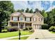 Charming two-story brick home with well-manicured lawn and inviting curb appeal at 1652 Park Hollow Ln, Lawrenceville, GA 30043