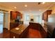 Modern kitchen with stainless appliances, granite countertops, hardwood floors, and an open layout to the living room at 1652 Park Hollow Ln, Lawrenceville, GA 30043