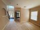 Spacious living room with high ceilings, neutral carpet, and a grand entrance at 1652 Park Hollow Ln, Lawrenceville, GA 30043