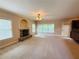 Cozy living room with a stone fireplace and large windows for ample natural light at 1652 Park Hollow Ln, Lawrenceville, GA 30043
