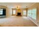 Spacious living room with fireplace and large windows, providing ample natural light at 1652 Park Hollow Ln, Lawrenceville, GA 30043