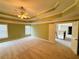 Spacious main bedroom featuring a trey ceiling and fan at 1652 Park Hollow Ln, Lawrenceville, GA 30043