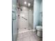 Updated bathroom with walk-in shower, clear glass surround, and modern fixtures at 3836 Vineyards Lake Nw Cir # U17, Kennesaw, GA 30144