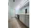 Large bathroom boasting a long dual sink vanity with updated hardware and tile flooring at 3836 Vineyards Lake Nw Cir # U17, Kennesaw, GA 30144