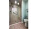 Updated bathroom with a walk-in shower, clear glass surround, and grab bar at 3836 Vineyards Lake Nw Cir # U17, Kennesaw, GA 30144
