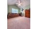 Bedroom with vaulted ceiling, neutral carpet and large window at 3836 Vineyards Lake Nw Cir # U17, Kennesaw, GA 30144