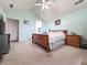 This cozy bedroom features light walls, carpet floors, and vaulted ceiling at 3836 Vineyards Lake Nw Cir # U17, Kennesaw, GA 30144