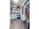 Walk-in closet with installed wire shelving and ample storage space for any wardrobe at 3836 Vineyards Lake Nw Cir # U17, Kennesaw, GA 30144