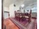 Dining room featuring a vintage table, seating for six, and hardwood flooring at 3836 Vineyards Lake Nw Cir # U17, Kennesaw, GA 30144
