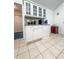 Bright kitchen with white cabinets, granite countertops, glass cupboards and tile flooring at 3836 Vineyards Lake Nw Cir # U17, Kennesaw, GA 30144