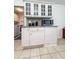 Bright kitchen with white cabinets, granite countertops, glass cupboards and tile flooring at 3836 Vineyards Lake Nw Cir # U17, Kennesaw, GA 30144