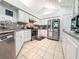Bright kitchen with white cabinetry, stainless steel appliances and granite countertops at 3836 Vineyards Lake Nw Cir # U17, Kennesaw, GA 30144