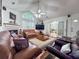 Bright living room with vaulted ceiling, large window, wood floors, and comfortable furnishings at 3836 Vineyards Lake Nw Cir # U17, Kennesaw, GA 30144