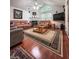 Cozy living room with hardwood floors, vaulted ceiling, and fireplace create an inviting and relaxing atmosphere at 3836 Vineyards Lake Nw Cir # U17, Kennesaw, GA 30144
