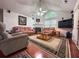 Inviting living room with vaulted ceilings, ample seating, fireplace, and a large window, perfect for relaxation and entertaining at 3836 Vineyards Lake Nw Cir # U17, Kennesaw, GA 30144