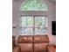 Living room featuring a large window with bright natural light at 3836 Vineyards Lake Nw Cir # U17, Kennesaw, GA 30144