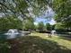 Picturesque pond showcasing fountains, benches, and lush landscaping, creating a relaxing environment for residents to unwind at 3836 Vineyards Lake Nw Cir # U17, Kennesaw, GA 30144