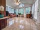 The sun room features vaulted ceilings, multiple windows, and tile flooring at 3836 Vineyards Lake Nw Cir # U17, Kennesaw, GA 30144
